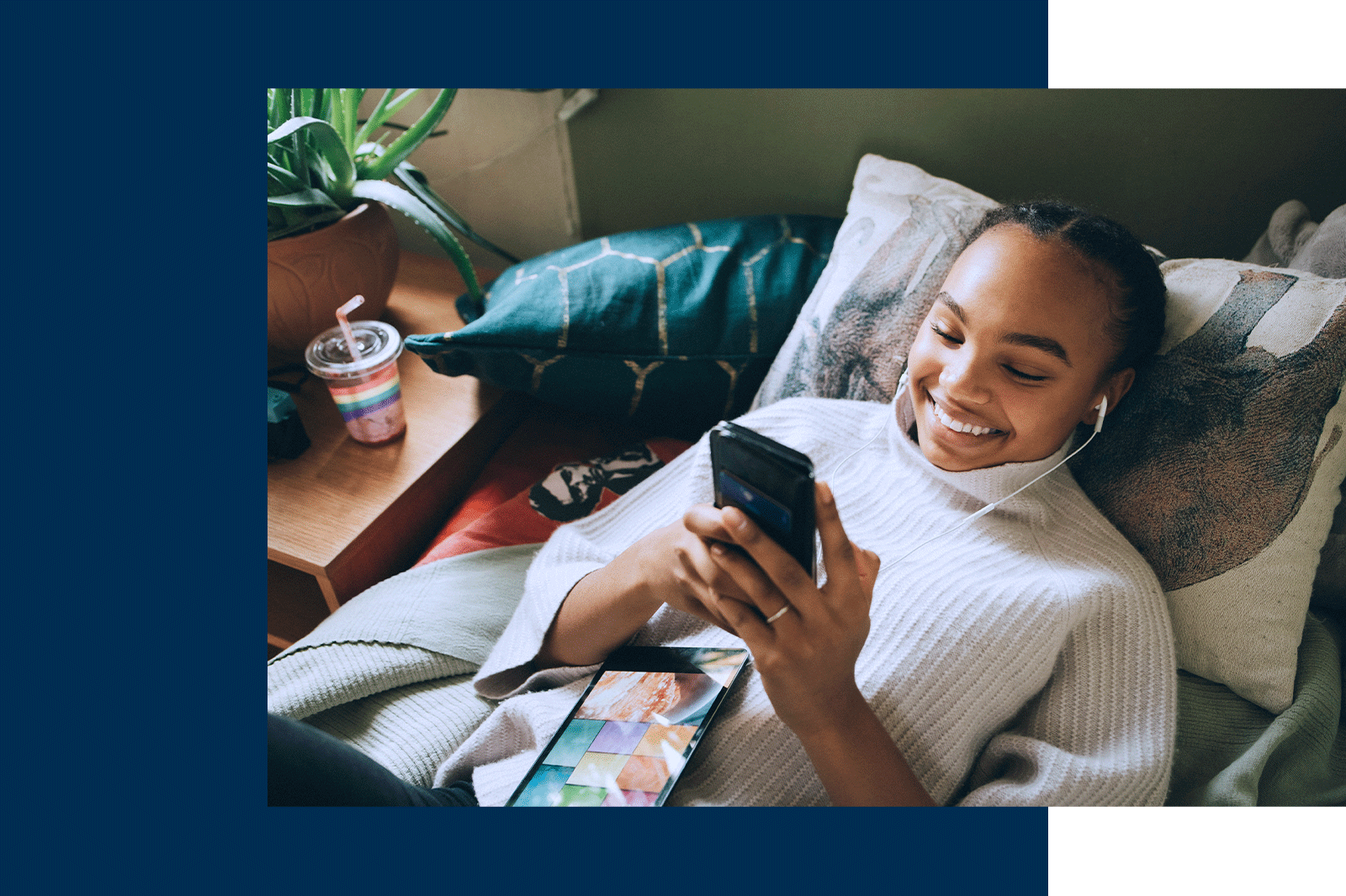 Gen Z student browsing on her phone, lying on a bed Gen Z student browsing on her phone, lying on a bed